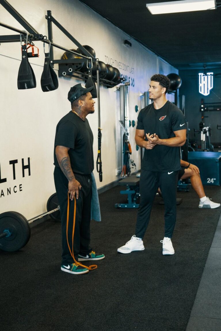 Trainers coaching clients at Stealth Performance, a personal training gym in Phoenix