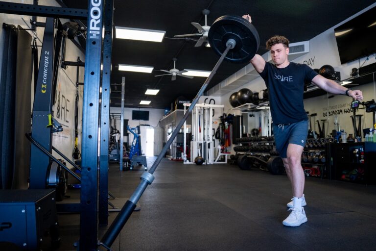 Teen athlete doing a single-leg jump drill during speed training at Stealth Performance